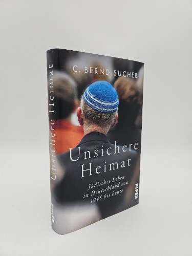 Buchcover und Innenansicht für das Buch: Unsichere Heimat